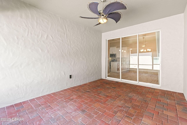 3402 Torre Blvd, New Smyrna Beach, FL 32168 - unfurnished sunroom with a chandelier