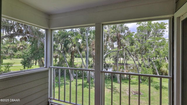 156 Grand Oaks Cir, Daytona Beach, FL 32114 - unfurnished sunroom featuring view of scattered trees