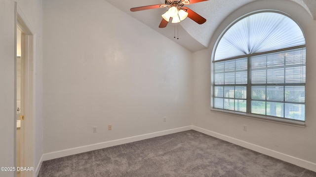 156 Grand Oaks Cir, Daytona Beach, FL 32114 - spare room with vaulted ceiling, dark colored carpet, and a ceiling fan