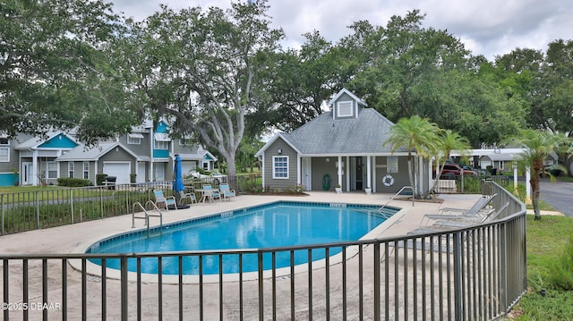156 Grand Oaks Cir, Daytona Beach, FL 32114 - community pool with a patio area