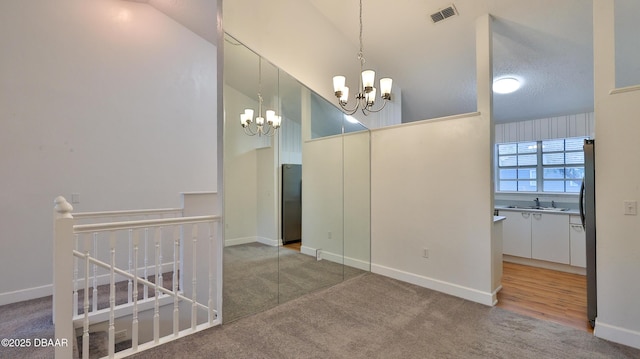 156 Grand Oaks Cir, Daytona Beach, FL 32114 - carpeted spare room featuring a chandelier and a sink