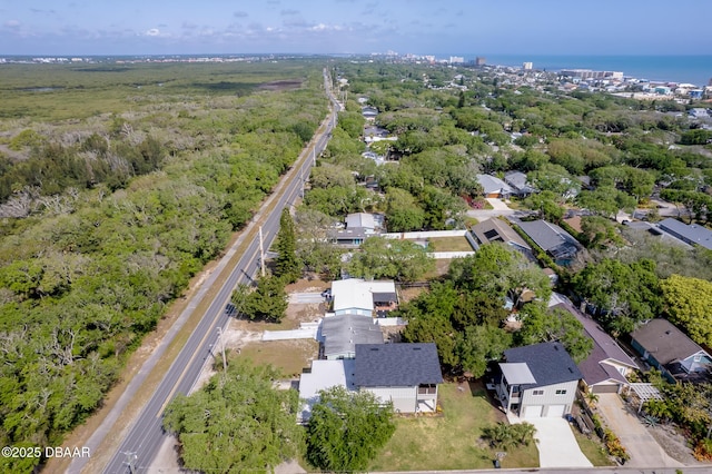 aerial view featuring a view of trees and a residential view