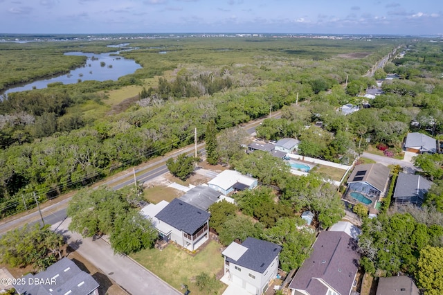 bird's eye view with a forest view, a residential view, and a water view