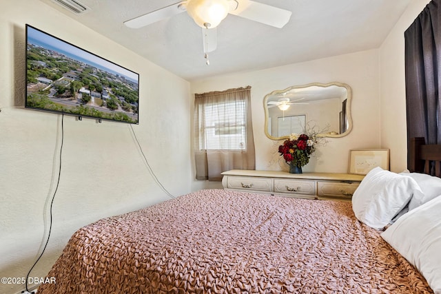 bedroom with visible vents and a ceiling fan