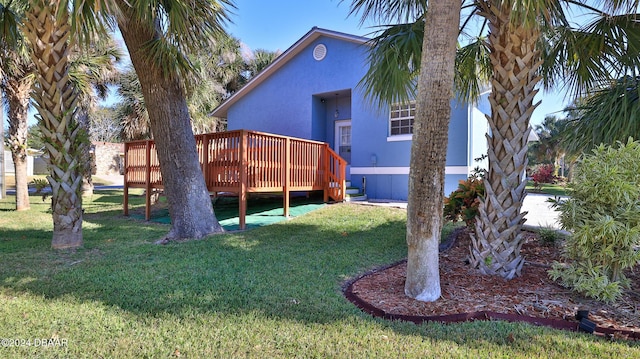 exterior space featuring a yard and a deck