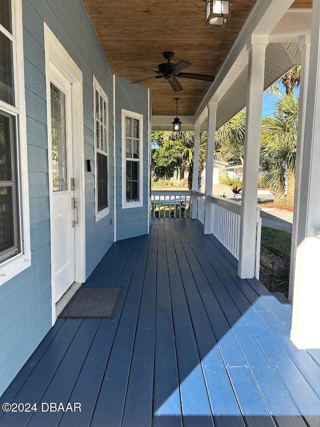 wooden deck with ceiling fan and covered porch