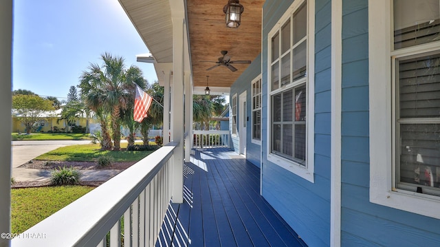 deck featuring a porch and ceiling fan