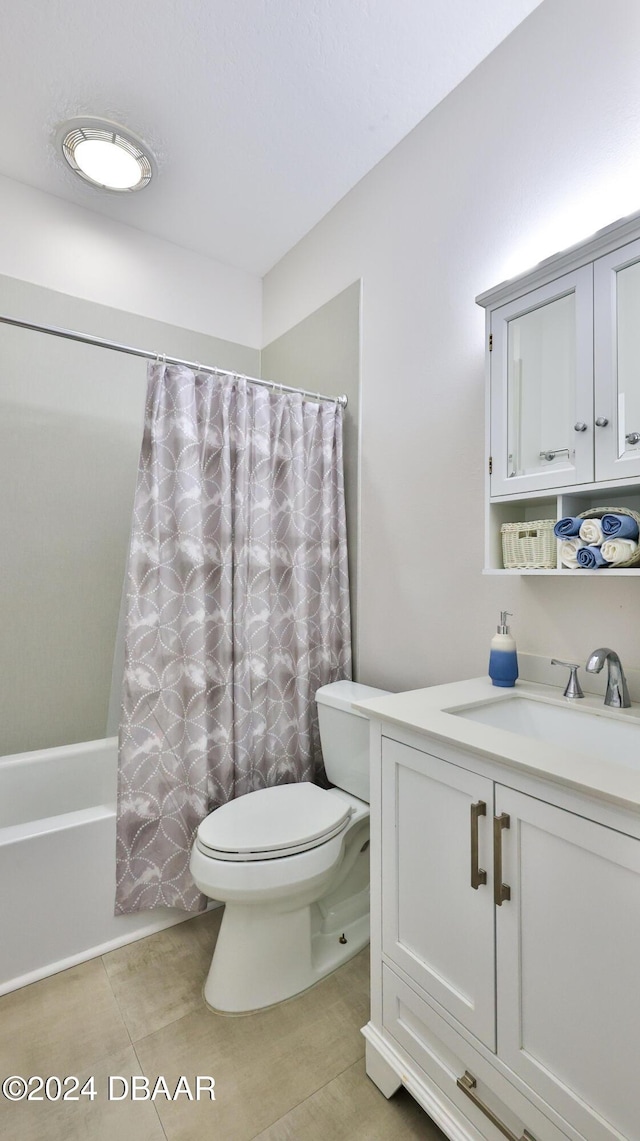 full bathroom with tile patterned flooring, vanity, shower / bath combo, and toilet