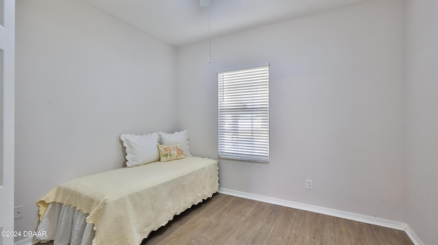 bedroom with hardwood / wood-style floors