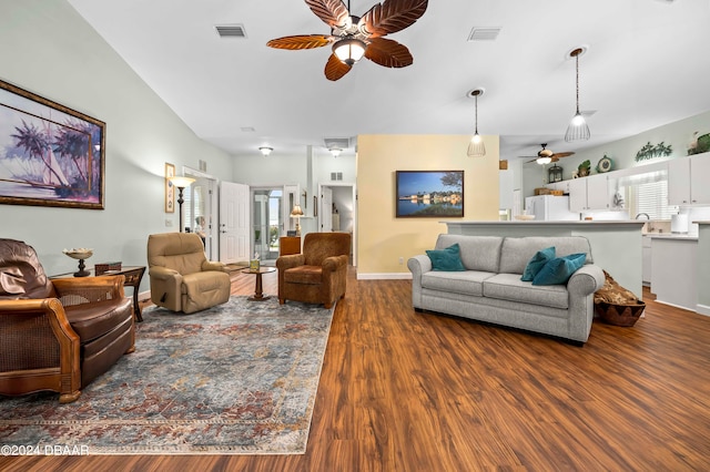 living room with hardwood / wood-style floors and ceiling fan