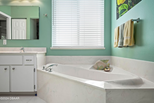 bathroom featuring a bath, vanity, and tile patterned flooring