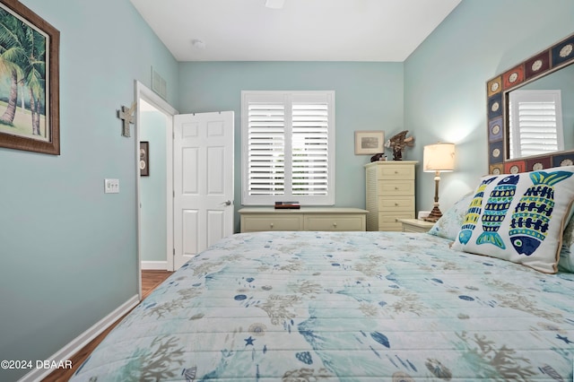 bedroom with wood-type flooring