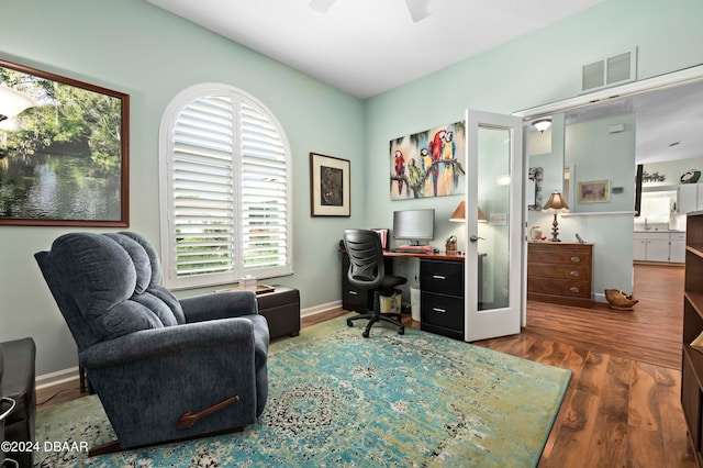 office area featuring ceiling fan and dark hardwood / wood-style floors