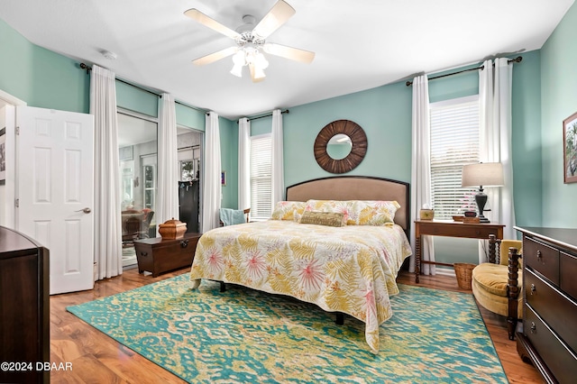 bedroom with ceiling fan and light wood-type flooring