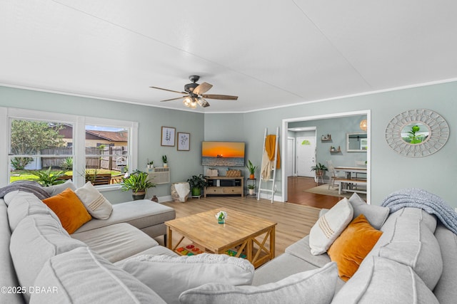 1245 Thomas Dr, Port Orange, FL 32129 - living room featuring wood finished floors, ceiling fan, crown molding, and baseboards