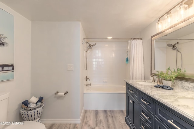 full bathroom with wood-type flooring, toilet, shower / tub combo, and vanity