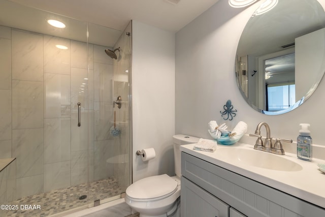 bathroom featuring vanity, toilet, and walk in shower