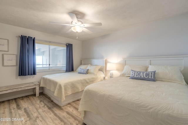 bedroom with wood-type flooring and ceiling fan