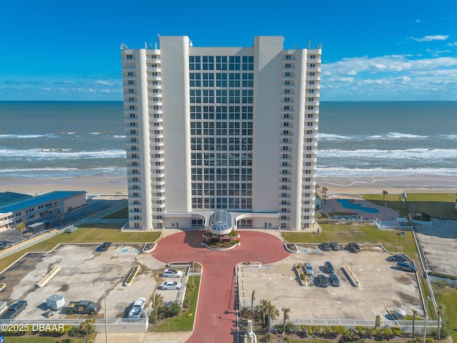 aerial view featuring a water view and a beach view