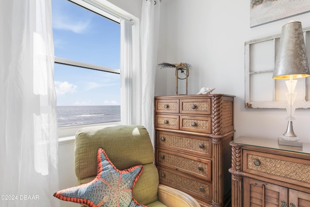 living area featuring a water view