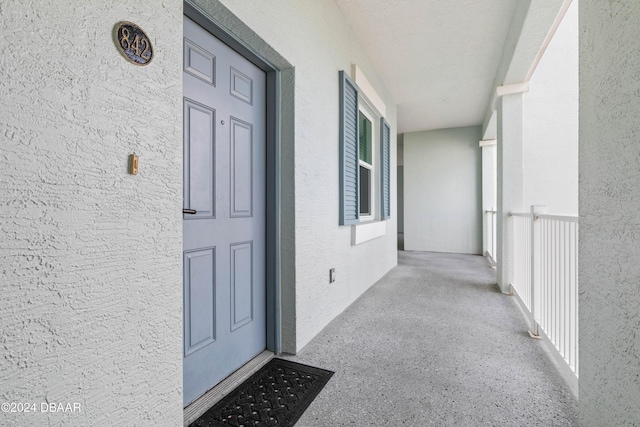 property entrance with covered porch