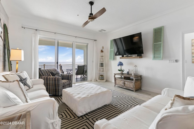 living room featuring ceiling fan and light hardwood / wood-style floors