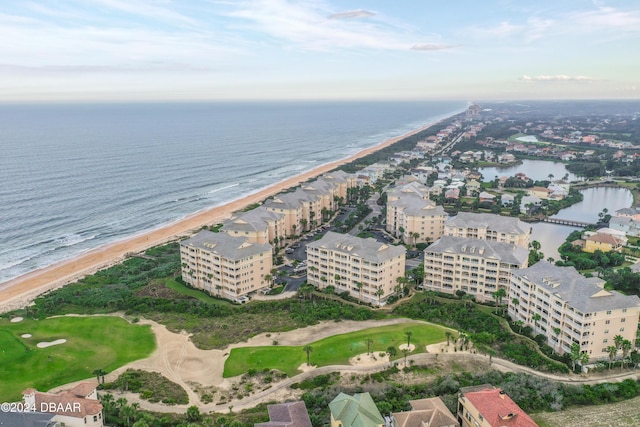 drone / aerial view featuring a water view and a beach view