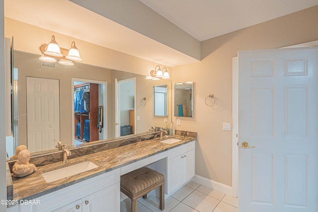 bathroom featuring tile patterned floors and vanity