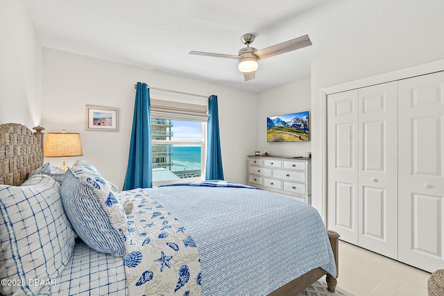 3721 S Atlantic Ave Unit 801, Daytona Beach Shores, FL 32116 - bedroom with a closet, a ceiling fan, and light tile patterned floors