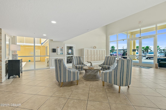 3721 S Atlantic Ave Unit 801, Daytona Beach Shores, FL 32116 - living room with light tile patterned floors, recessed lighting, and french doors