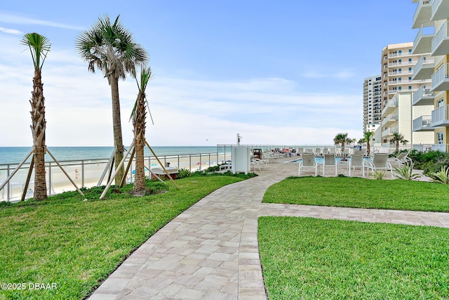 3721 S Atlantic Ave Unit 801, Daytona Beach Shores, FL 32116 - view of community with a water view and a lawn