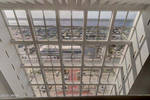 room details featuring beam ceiling and a water view