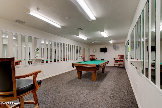 playroom featuring pool table, a textured ceiling, and dark carpet