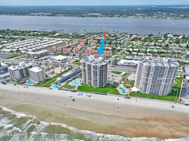 bird's eye view featuring a beach view and a water view