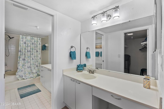 bathroom with shower / bath combo with shower curtain, vanity, and tile patterned floors