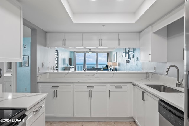 kitchen with white cabinetry, sink, and stainless steel dishwasher