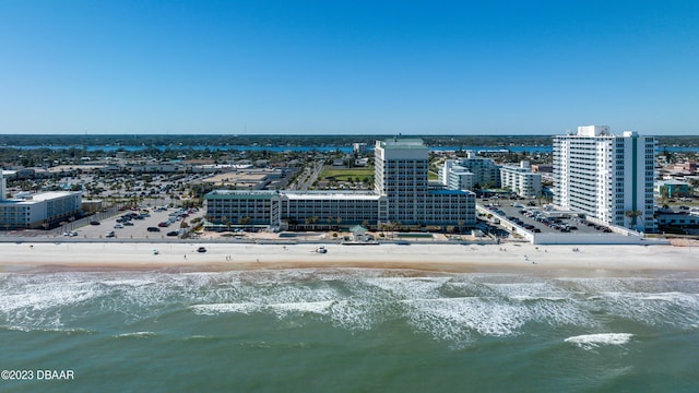 drone / aerial view featuring a view of the beach and a water view