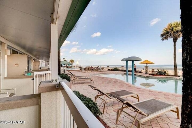 balcony featuring a water view