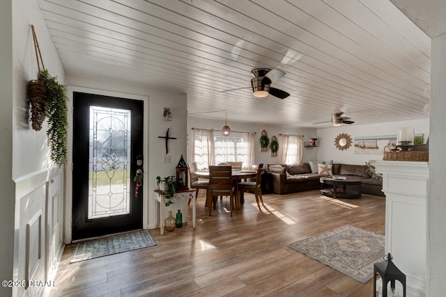 foyer entrance with wooden ceiling and wood finished floors