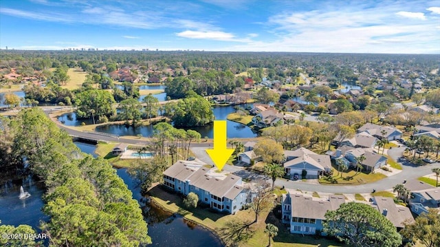 birds eye view of property with a water view