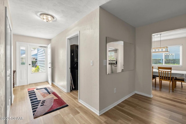 entrance foyer with hardwood / wood-style flooring and a textured ceiling