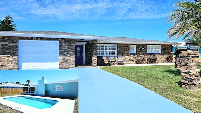 exterior space featuring a fenced in pool, a garage, and a front yard