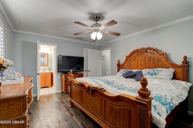 bedroom featuring dark wood-type flooring, a textured ceiling, connected bathroom, ceiling fan, and crown molding