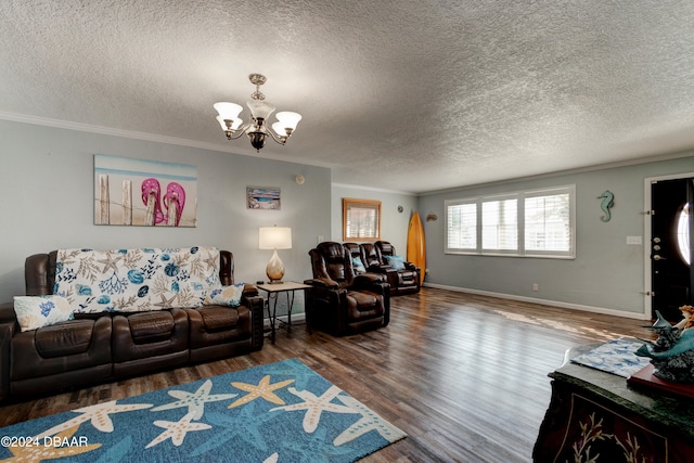 living room featuring ornamental molding, hardwood / wood-style floors, a notable chandelier, and a textured ceiling