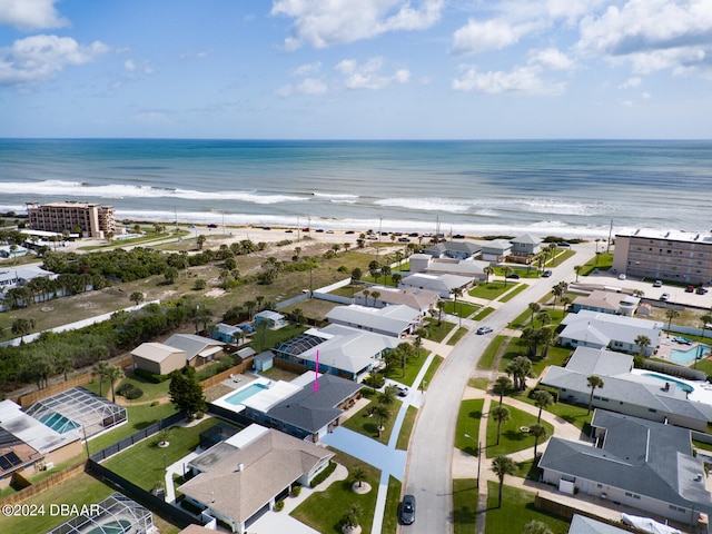 drone / aerial view with a view of the beach and a water view