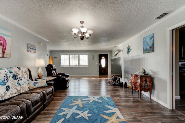 living room featuring an inviting chandelier, a textured ceiling, dark hardwood / wood-style floors, and crown molding