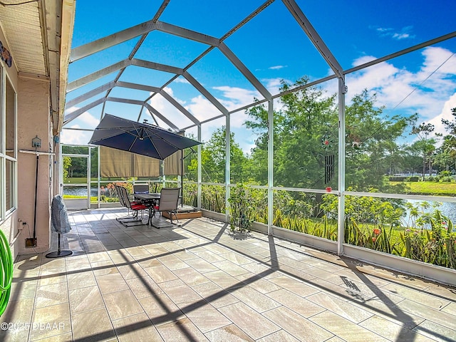 1840 Tara Marie Ln, Port Orange, FL 32128 - unfurnished sunroom featuring lofted ceiling, outdoor dining area, and plenty of natural light