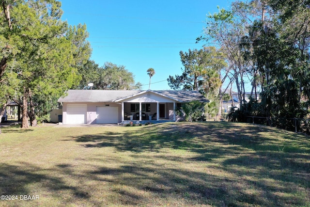 ranch-style home with a front yard and a garage