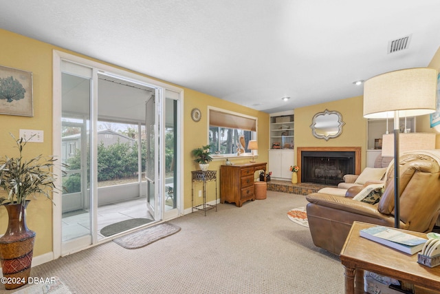 carpeted living room featuring built in features