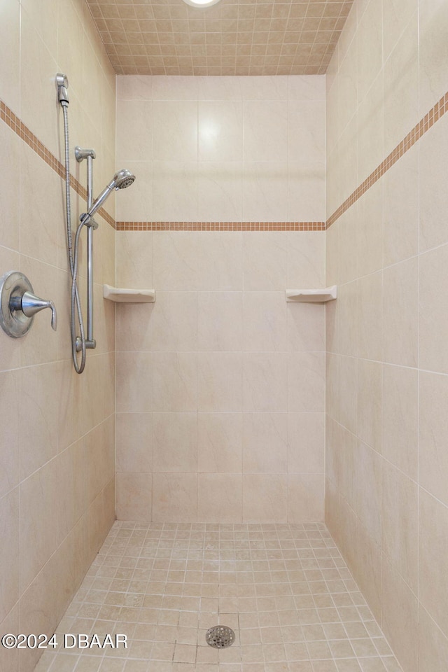 bathroom with tiled shower